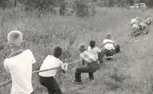 Boys participating in a tug-of-war during the Robbers Cave experiment